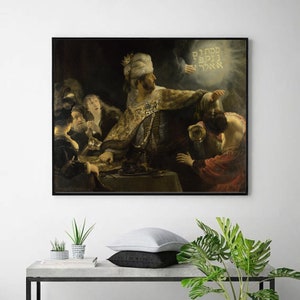 May include: A painting depicting a scene from the Bible, with a man in a turban and robe gesturing towards a group of people. The painting is set in a dark room with a single light source illuminating the figures. The text "ריבון" is visible in the upper right corner of the painting.