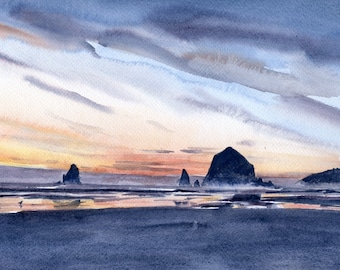 May include: A watercolor painting of a coastal scene at sunset featuring dark, jagged rock formations rising from a wet, reflective beach. The sky is filled with soft, layered clouds in shades of blue, gray, and orange, casting a warm glow over the horizon.