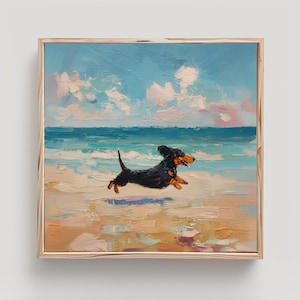 May include: An oil painting in a light wood frame depicting a black and tan dachshund running across a sandy beach. The scene features a bright blue sky with white clouds, a turquoise ocean with gentle waves, and textured brushstrokes throughout.