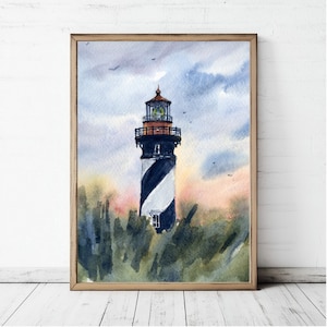 May include: Watercolor painting of a lighthouse with black and white stripes, set against a cloudy sky with hints of pink and yellow. The lighthouse is framed in a wooden border and surrounded by green foliage.