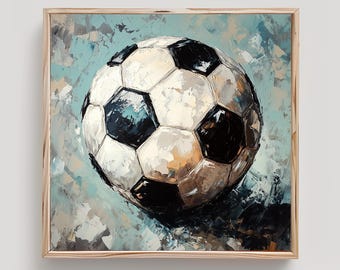 May include: A framed painting of a soccer ball. The ball is white with black pentagons, rendered with thick brushstrokes. The background is a blend of blue, gray, and white, creating a textured effect. The artwork is in a light wood frame.