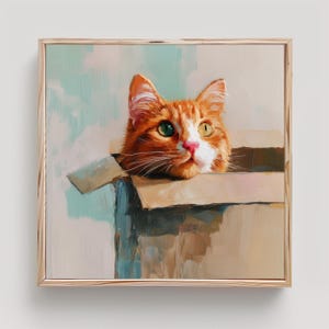 May include: A square framed oil painting depicting an orange tabby cat with one green eye and one yellow eye peeking out from inside a brown cardboard box. The artwork features visible brushstrokes and a light blue and cream background.