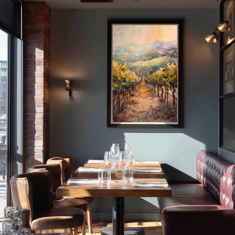 May include: A dining room scene featuring a framed watercolor painting of a vineyard. The room has a dark teal wall, a brick wall, and a burgundy leather booth. Wooden tables are set with glassware and silverware. Brown leather chairs are arranged around the tables.