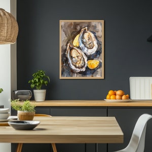 May include: Watercolor painting of two opened oysters with lemon wedges on a dark background. The artwork is framed in a light wood frame and hangs on a dark gray wall. The painting is a still life, depicting the oysters in detail.