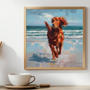 May include: A framed painting depicts a golden-red dog running on a beach. The artwork uses broad brushstrokes to create a textured effect, with a blue and white ocean and sky in the background. The dog's fur appears windswept.