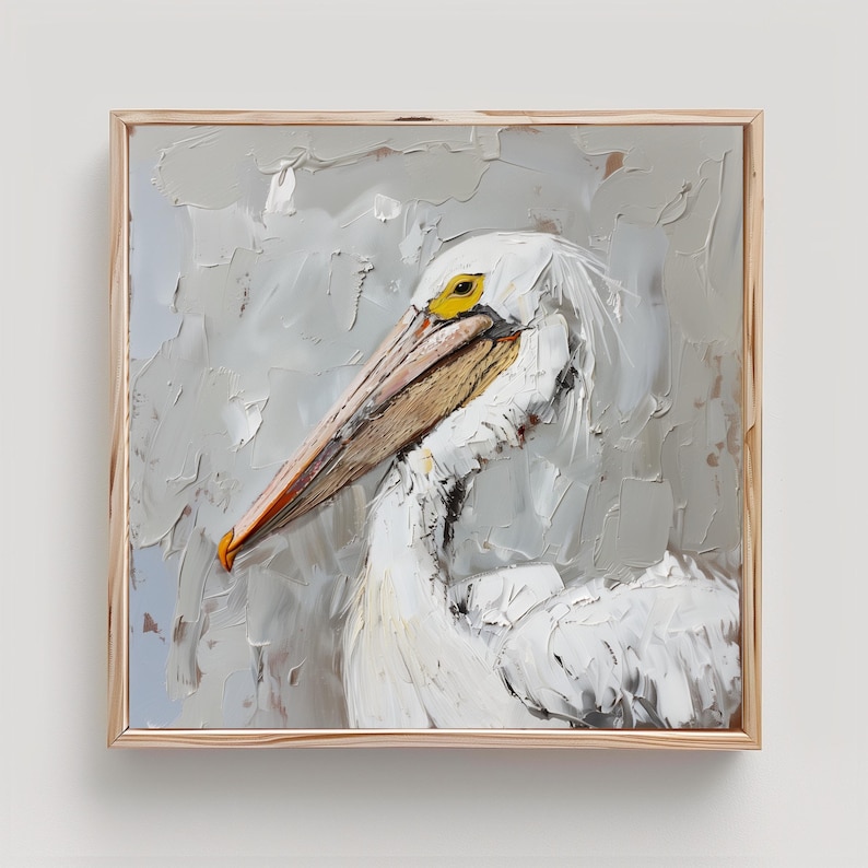 Pode incluir: Uma pintura a &oacute;leo quadrada emoldurada apresentando um pelicano branco com acabamento em empaste texturizado. A ave tem um olho amarelo proeminente e um bico longo de cor bege com detalhes em laranja sobre um fundo cinza neutro.