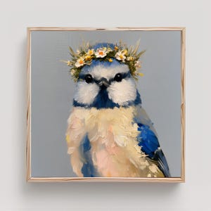 May include: A square framed oil painting of a blue tit bird with a thick, textured impasto finish. The bird features a blue and cream-colored chest, dark eyes, and a crown of small white and yellow flowers resting on its head.