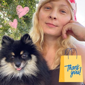 May include: A black and tan Pomeranian dog with its tongue sticking out, next to a yellow shopping bag with the words "Thank you!" in blue. Pink hearts are in the background. A person with blonde hair and a floral headscarf is in the background.
