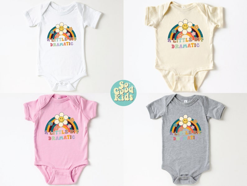 Pode incluir: Quatro bodies de beb&ecirc; em branco, bege, rosa e cinza com um gr&aacute;fico de arco-&iacute;ris e flores e o texto "A little bit dramatic".