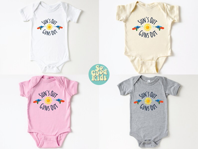 May include: Four baby onesies in white, cream, pink, and gray, each with the text "SUN'S OUT GUNS OUT" and a graphic of a sun and water guns. The onesies are short-sleeved.