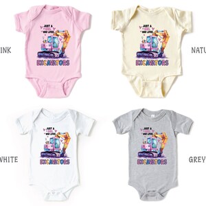 May include: Four baby onesies in pink, natural, white, and grey. Each features a colorful excavator graphic with the text "Just a girl who loves excavators". The So Good Kids logo is in the bottom right corner.