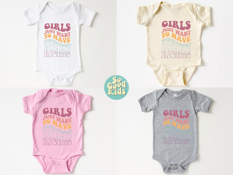 May include: Four baby onesies in different colors, white, cream, pink, and gray. Each onesie has the text "Girls Just Want To Have Human Rights" printed in a rainbow color scheme.