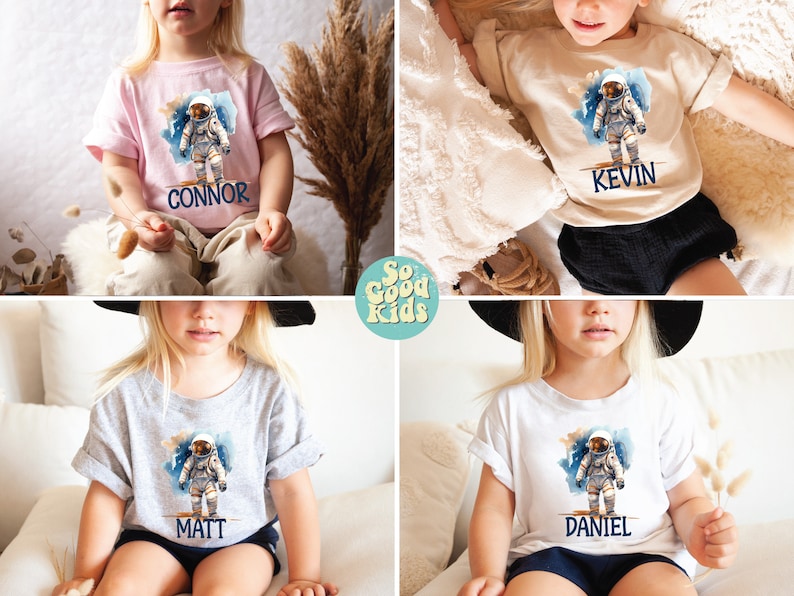 May include: Four children's t-shirts with an astronaut graphic and personalized names. The shirts are in pink, beige, grey, and white. The names on the shirts are Connor, Kevin, Matt, and Daniel.