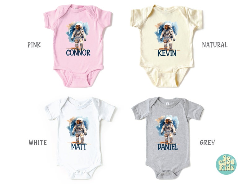 May include: Four baby onesies in pink, white, natural, and grey with a watercolor astronaut design and personalized names: Connor, Kevin, Matt, and Daniel.