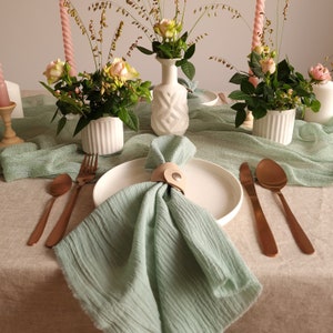 Muslin napkins and sage napkins are the perfect choice for wedding tables, offering a blend of soft texture and understated luxury that elevates any setting.