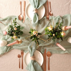 Muslin napkins and sage napkins grace your wedding table with their gentle feel and timeless appeal, ensuring a memorable dining experience for your guests.