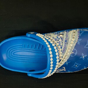 Blue bedazzled luxury crocs. Bling with pearls, rhinestones, denim and croc charms.