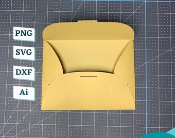 May include: A folded, light brown paper envelope with a tab closure. The image includes the text "PNG", "SVG", "DXF", and "Ai" in white boxes, and a green "Download" button. The envelope is on a gray cutting mat.
