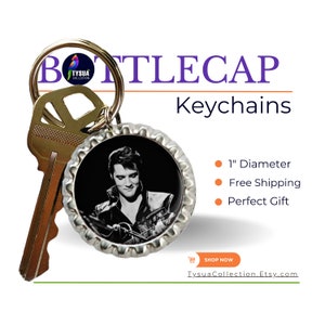May include: A silver bottle cap keychain with a black and white image of Elvis Presley playing a guitar. The keychain is 1 inch in diameter.