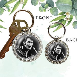 May include: A silver key chain with a black and white image of Elvis Presley on a bottle cap. The front of the bottle cap shows Elvis singing into a microphone. The back of the bottle cap shows Elvis with his hair slicked back. The words "FRONT" and "BACK" are printed on the image.