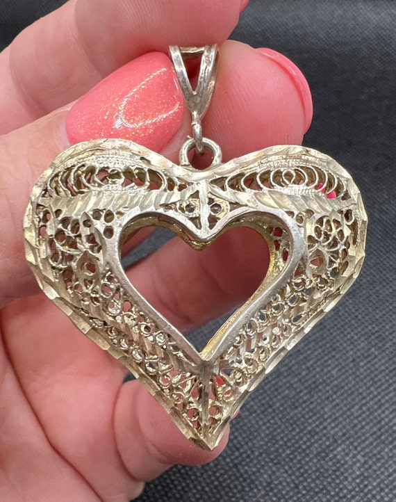 Vintage silver filigree heart pendant