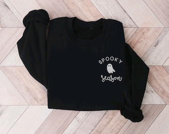 May include: Black sweatshirt with a white ghost and the text "Spooky Season" on the front.