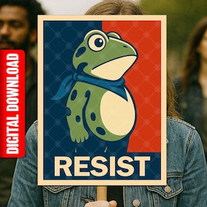May include: A poster featuring a green frog with a blue scarf, set against a red and blue background. The word "RESIST" is printed in bold white letters at the bottom. The poster has a vintage, propaganda-style design.