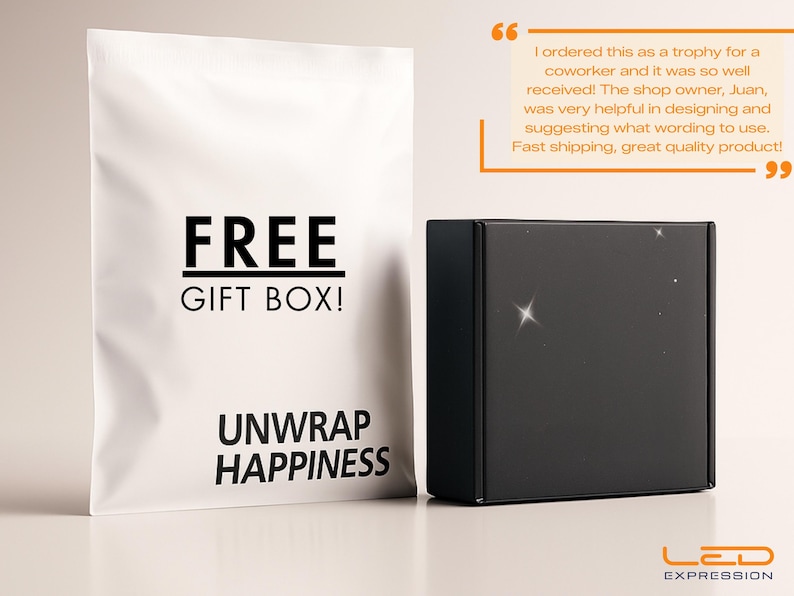May include: A black gift box and a white bag with the text "FREE GIFT BOX!" and "UNWRAP HAPPINESS". The box has a shiny surface. The LED EXPRESSION logo is at the bottom right.