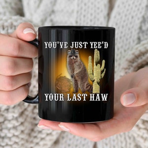 Funny Yeehaw Raccoon Coffee Mug For Goblincore Gen Z Raccoon Gifts for Meme Lovers
