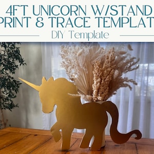 May include: A gold cardboard unicorn cutout, 4 feet tall, with a stand. The unicorn is standing on a wooden table with a vase of dried flowers behind it. The text "4FT UNICORN W/STAND PRINT & TRACE TEMPLATE DIY Template" is at the top of the image.