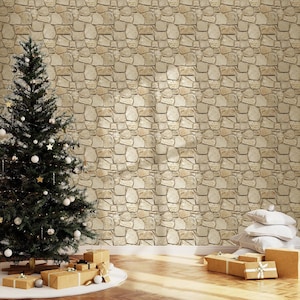 May include: A tall, dark green Christmas tree decorated with white ornaments and gold stars stands beside a wall covered in light brown stone-patterned wallpaper. Several wrapped gift boxes with ribbons sit on the floor near the tree.
