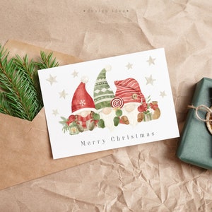 Festive Christmas card with a cute watercolor gnome illustration, complemented by seasonal elements like holly and stars