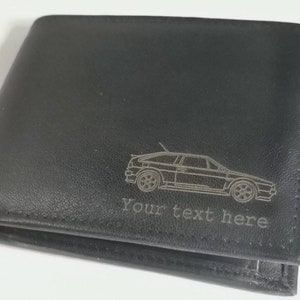 May include: Black leather wallet with a silver-colored outline of a car and the text "Your text here".