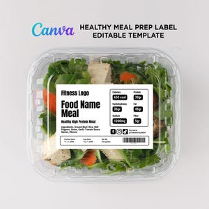 May include: A white label with black text on a clear plastic container filled with a salad. The label says "Fitness Logo", "Food Name Meal", "Healthy High Protein Meal", "Calories: 650 ccal", "Protein: 30gr", "Carbohydrates: 35gr", "Fat: 45gr", "Sodium: 1200mg", "Fiber: 5gr", "Ingredients: Ground Beef, Rice, Bell Peppers, Onion, Garlic Tomato Sauce Spices, Cheese", "Packed Date: 11.11.2040", "Exp Date: 12.11.2048", "Net Wt: 250 grams", "Follow Us: YOURSOCIALMEDIA".