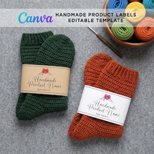 A pair of crocheted socks—one dark green with a brown kraft paper label and one rust-orange with a white paper label—displayed flat on a grey textured background next to a wooden bowl filled with colorful yarn skeins. A Canva editable template banner is featured at the top.