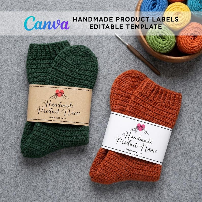 A pair of crocheted socks—one dark green with a brown kraft paper label and one rust-orange with a white paper label—displayed flat on a grey textured background next to a wooden bowl filled with colorful yarn skeins. A Canva editable template banner is featured at the top.