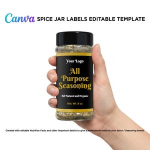 Hand holding an all-purpose seasoning spice jar mockup featuring a luxury black and gold label template created for Canva.