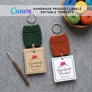 Two miniature crocheted keychains—one dark green with a square brown kraft paper tag and one rust-orange with a white paper tag—resting on a grey surface with a crochet hook and a bowl of yarn. A Canva template overlay is visible at the top.