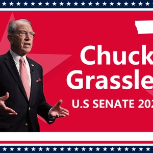 May include: A red and white campaign poster with a photo of Chuck Grassley, a white male with gray hair, wearing a dark suit and a pink tie. The poster also includes the text "Chuck Grassley" in white letters and "U.S. SENATE 2022" in white letters. The state of Iowa is outlined in white in the upper right corner of the poster.