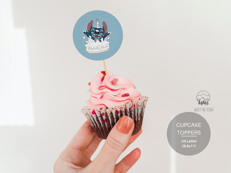 May include: A blue and white cupcake topper featuring a cartoon character with blue fur and big eyes, holding a lit candle and sitting on top of a cake. The topper is printed on a round, white cardstock and is attached to a wooden stick. The text "CUPCAKE TOPPERS" is printed in black on a gray background. The text "US Letter (8.5x11)" is printed in black below the text "CUPCAKE TOPPERS".