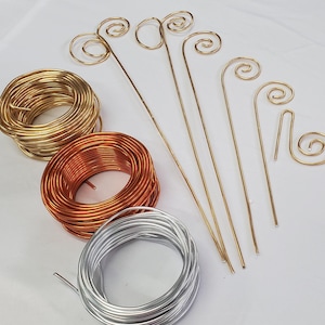 Wire wands for your fairy garden stakes in gold, silver or copper color to hang your favorite attachment in your plant. DIY garden stakes.