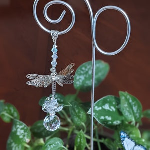 Garden stake suncatcher 16&quot; silver loop and coil wire with prism, octagons, beads, and a dragonfly with 3 sets of wings you can adjust.
