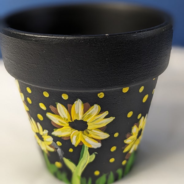 Hand painted 3 inches terracota pot  painted in Midnight blue  with yellow sunflowers, all finished with a clear protective coat.