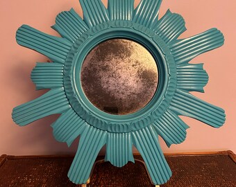 Teal sunburst mirror