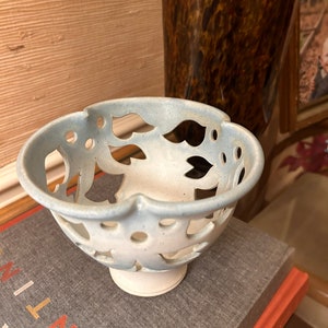 Signed ceramic floral cutout votive candle holder