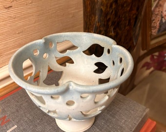 Signed ceramic floral cutout votive candle holder