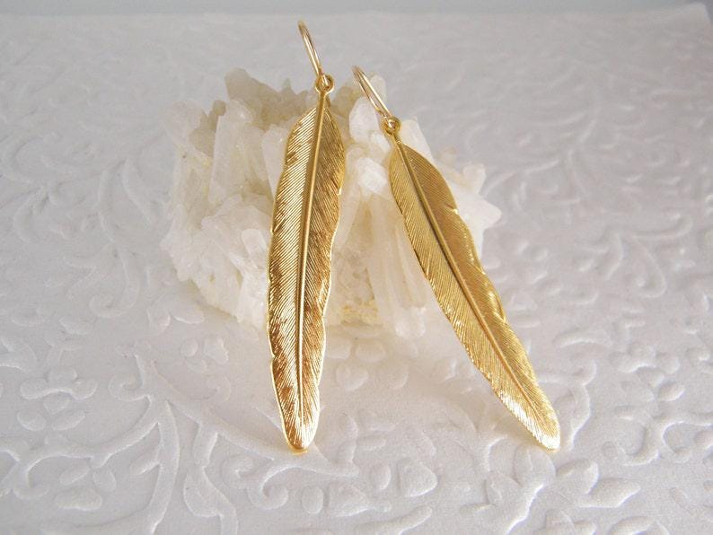 Gold feather dangle earring