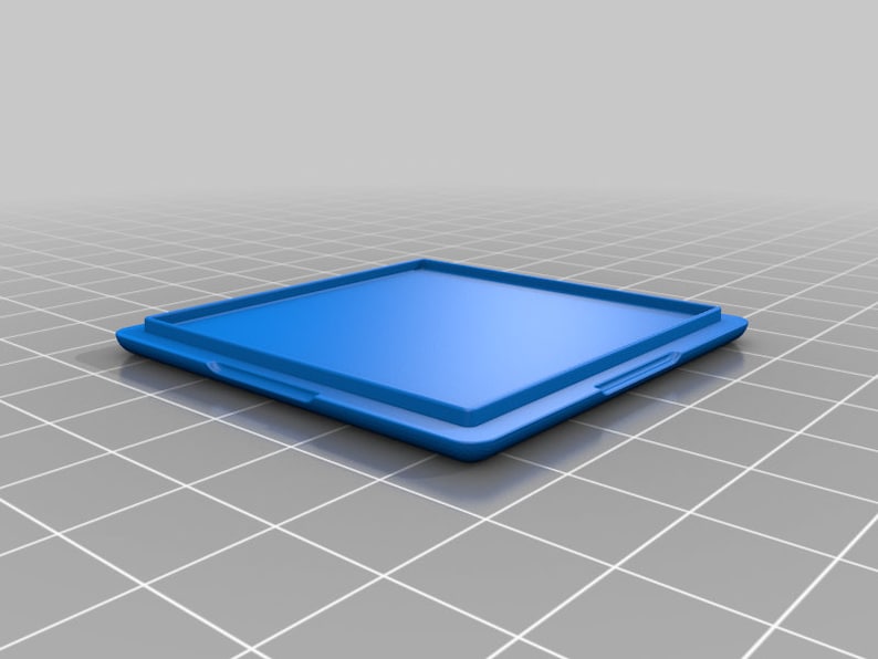 May include: A blue plastic square box with a hinged lid. The box is empty and has a smooth surface.
