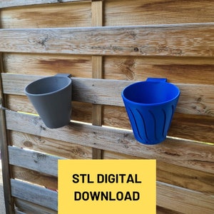 May include: Two 3D printed plant pots, one grey and one blue, are mounted on a wooden fence. The pots are designed to hold small plants or flowers. The text "STL DIGITAL DOWNLOAD" is printed on a yellow rectangle.