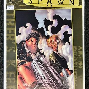 May include: A comic book cover featuring a gold background with the title "Curse of the Spawn" in black and gold lettering. The cover art depicts two men in suits holding a large gun, with smoke and buildings in the background.